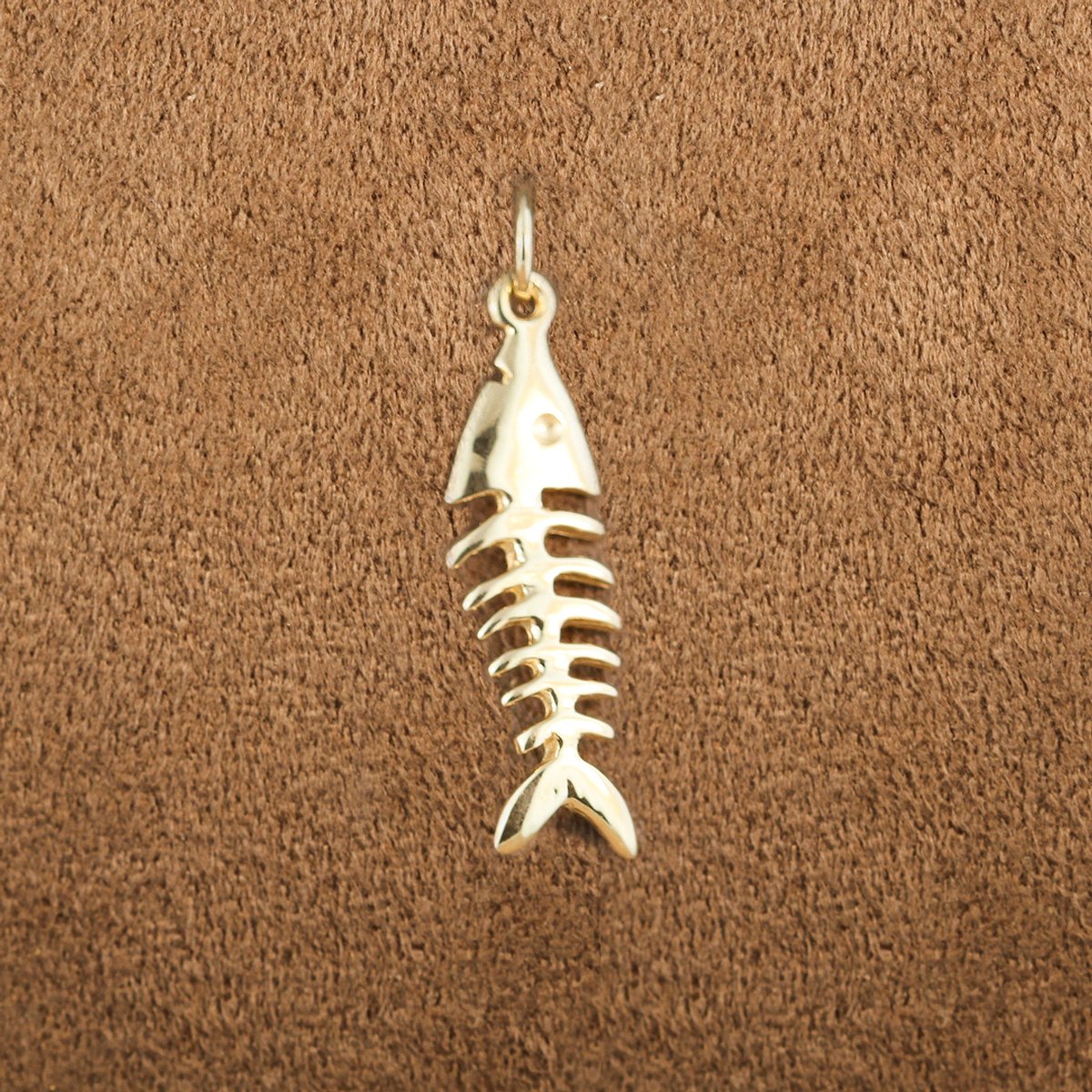 Fish skeleton charm